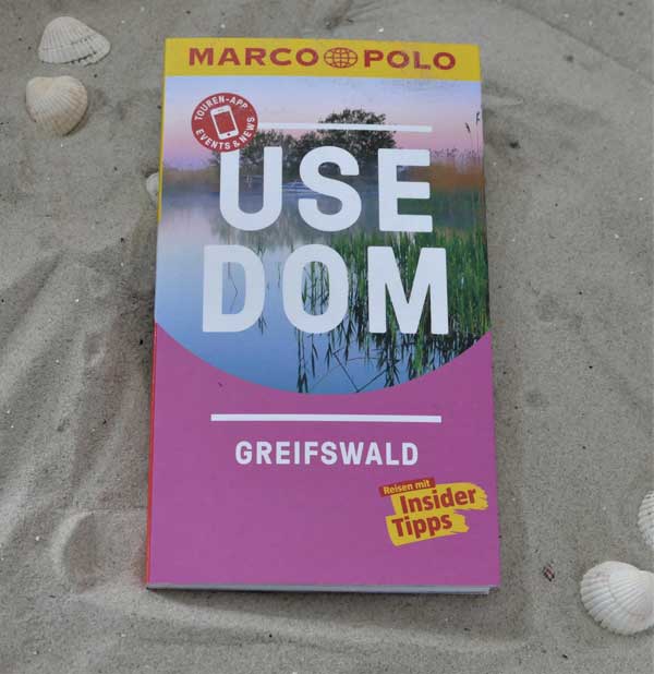 Image of a travel guide with the title "Usedom travel guide by Marco Polo" on the cover, which invites you to discover the island of Usedom with insider tips, adventure routes, sights, activities, events & tested accommodation